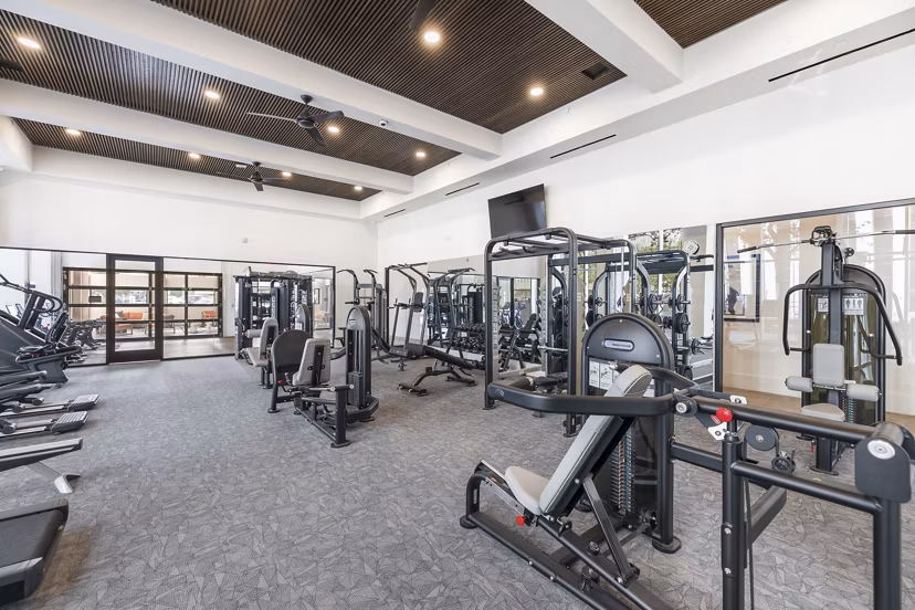 State-of-the-art fitness center with modern equipment at Elev8 Apartments offering luxury living experiences
