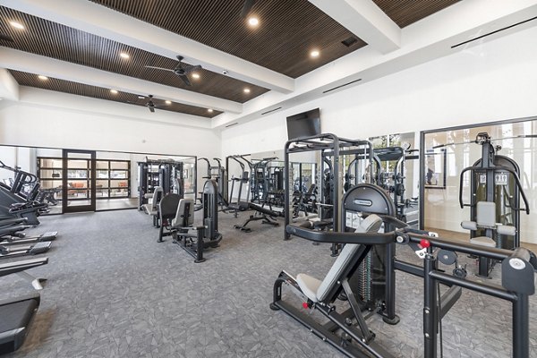 State-of-the-art fitness center with modern equipment at Elev8 Apartments offering luxury living experiences