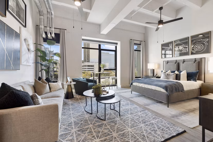 Living room with modern furniture and decorated walls at Elev8 Apartments