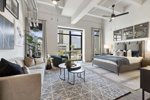 Living room with modern furniture and decorated walls at Elev8 Apartments