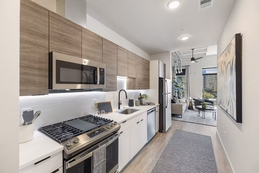 Modern kitchen with stainless steel appliances at Elev8 Apartments