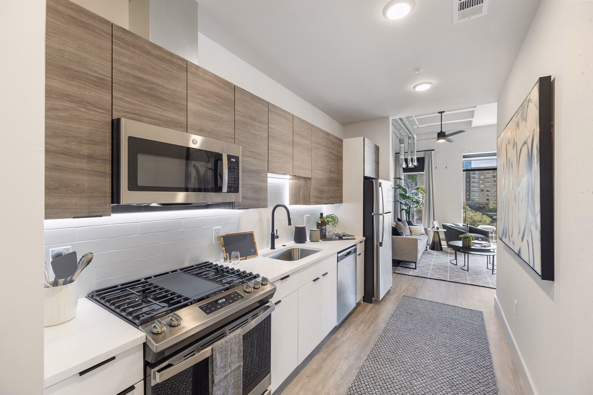 Modern kitchen with stainless steel appliances at Elev8 Apartments