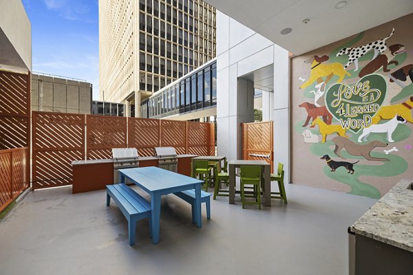 Grill area with modern seating at Elev8 Apartments, perfect for outdoor gatherings and dining in style