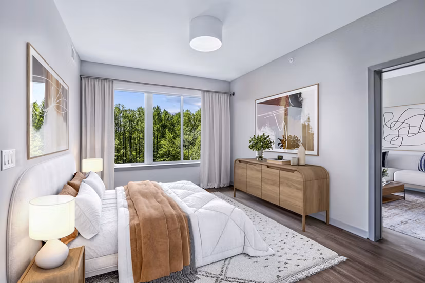 Bedroom with stylish decor and natural lighting at Vista Fairfax Corner Apartments, a luxury Greystar property in a prime location