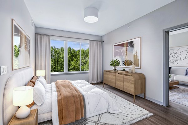 Bedroom with stylish decor and natural lighting at Vista Fairfax Corner Apartments, a luxury Greystar property in a prime location