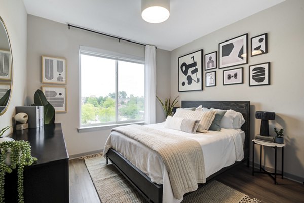 Spacious bedroom featuring modern decor at Vista Fairfax Corner Apartments