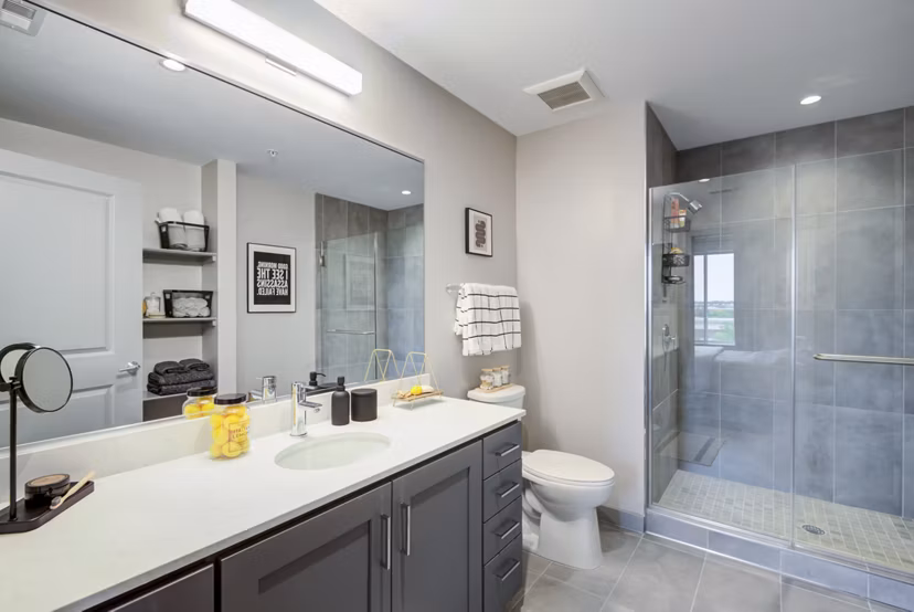 Bathroom featuring modern fixtures and elegant countertops in Vista Fairfax Corner Apartments