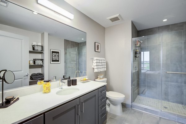 Bathroom featuring modern fixtures and elegant countertops in Vista Fairfax Corner Apartments
