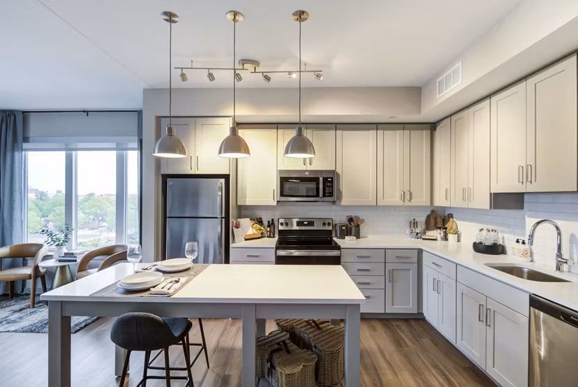 Dining area featuring elegant table settings and modern lighting at Vista Fairfax Corner luxury apartments
