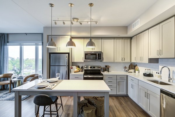 Dining area featuring elegant table settings and modern lighting at Vista Fairfax Corner luxury apartments