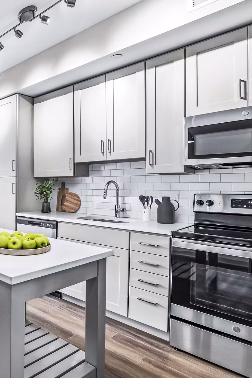 Modern kitchen with stainless steel appliances at Vista Fairfax Corner Apartments
