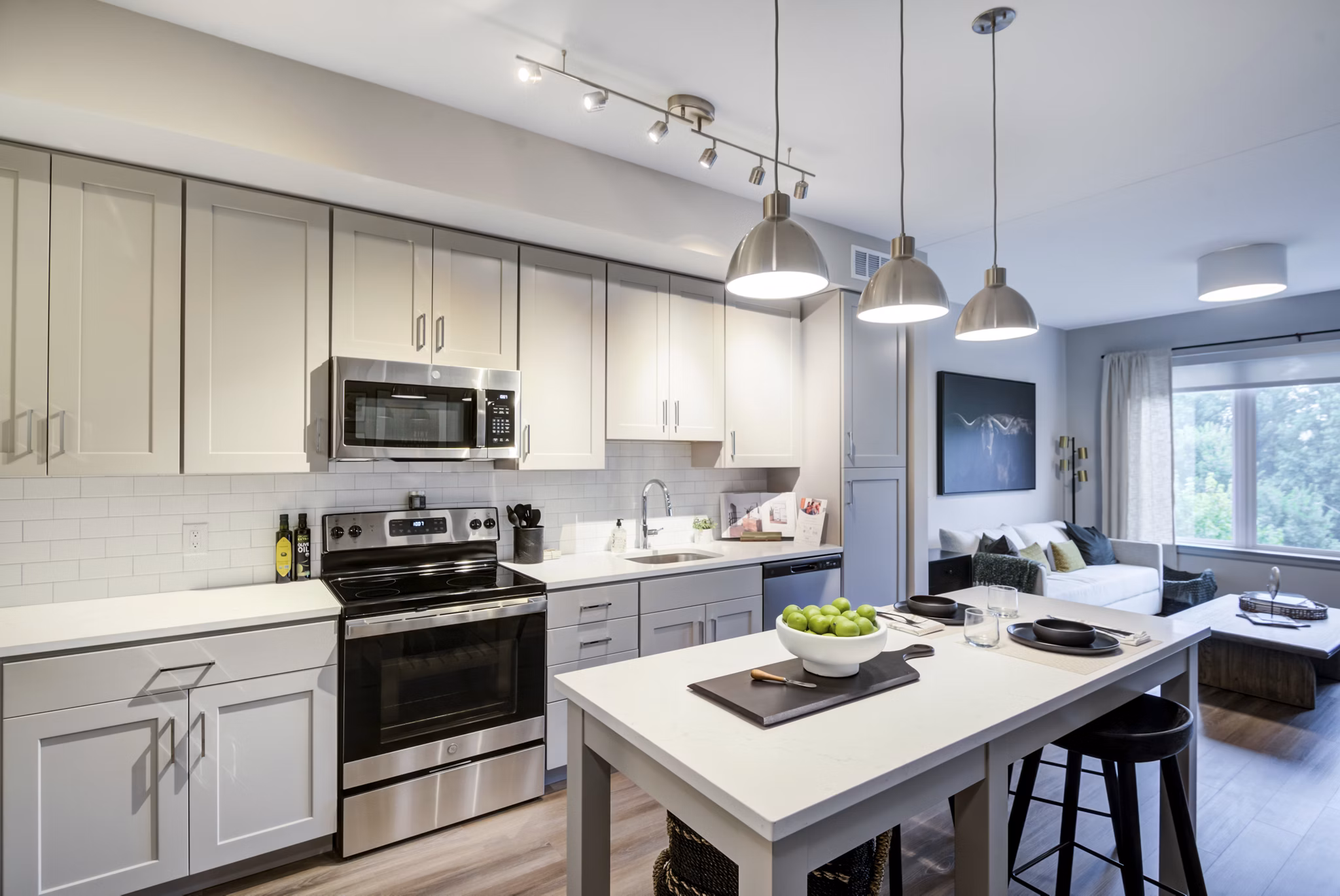 Modern kitchen with stainless steel appliances at Vista Fairfax Corner Apartments