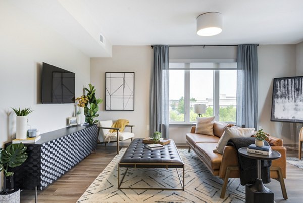 Spacious living room with modern decor and natural light in Vista Fairfax Corner Apartments