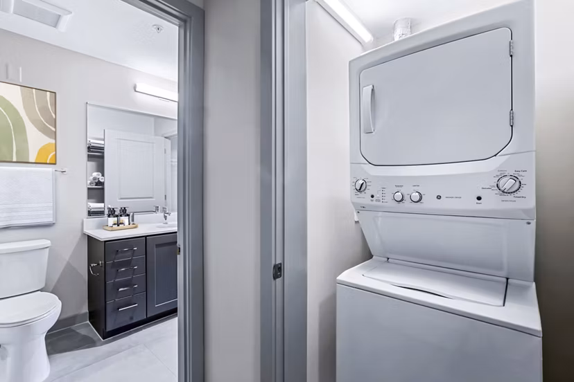 Modern laundry room with energy-efficient appliances in Vista Fairfax Corner Apartments