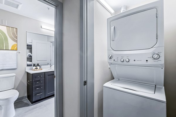 Modern laundry room with energy-efficient appliances in Vista Fairfax Corner Apartments