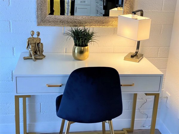 Home office setup with modern desk and ergonomic chair in Seventh Apartments, a Greystar luxury community