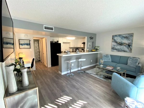 Living room with modern furnishings at Seventh Apartments, showcasing luxury urban living in the heart of the city