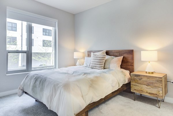 Elegant bedroom with modern decor at DASH Downers Grove Apartments offering luxury living spaces in a prime location