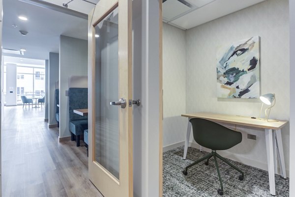 Clubhouse featuring modern interiors at DASH Downers Grove Apartments, a luxury property by Greystar