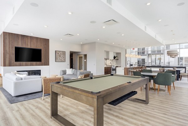 Clubhouse with modern decor at DASH Downers Grove Apartments offering luxury community space