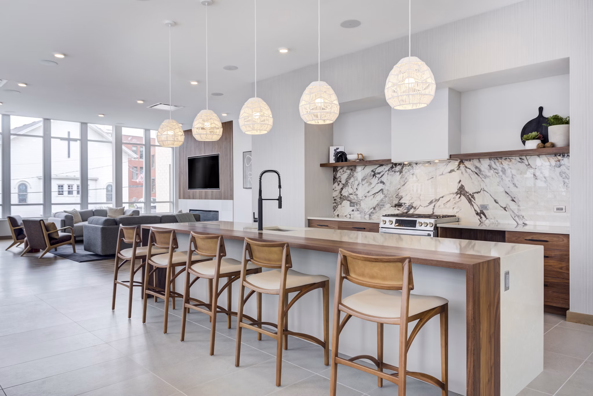 Clubhouse featuring modern seating and entertainment areas at DASH Downers Grove Apartments