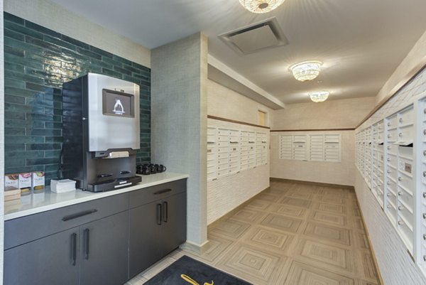 Bright mail room with parcel lockers at DASH Downers Grove Apartments