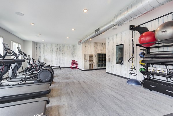 Modern fitness center with state-of-the-art equipment at DASH Downers Grove Apartments, designed for active living