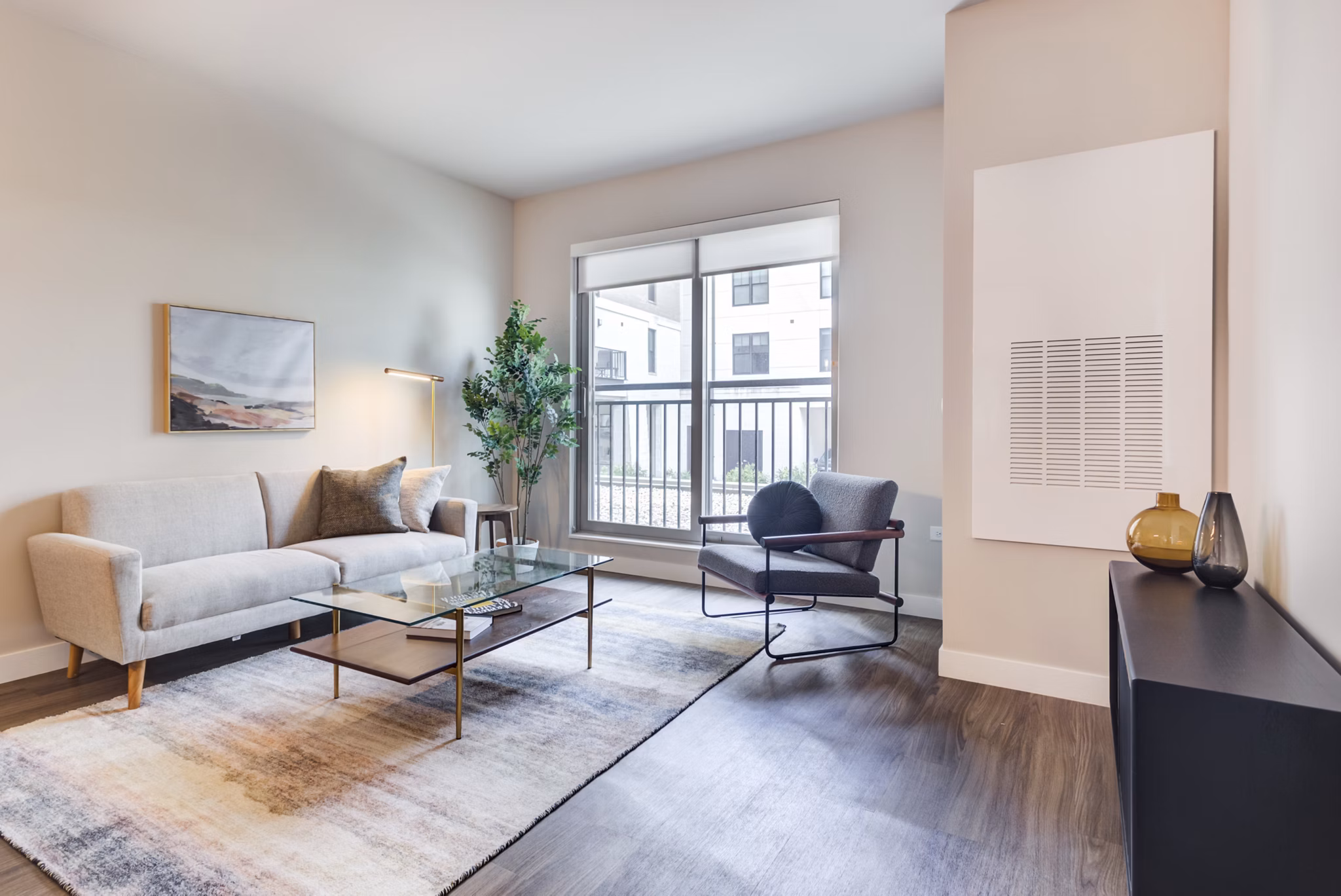 Spacious living room with modern decor at DASH Downers Grove Apartments