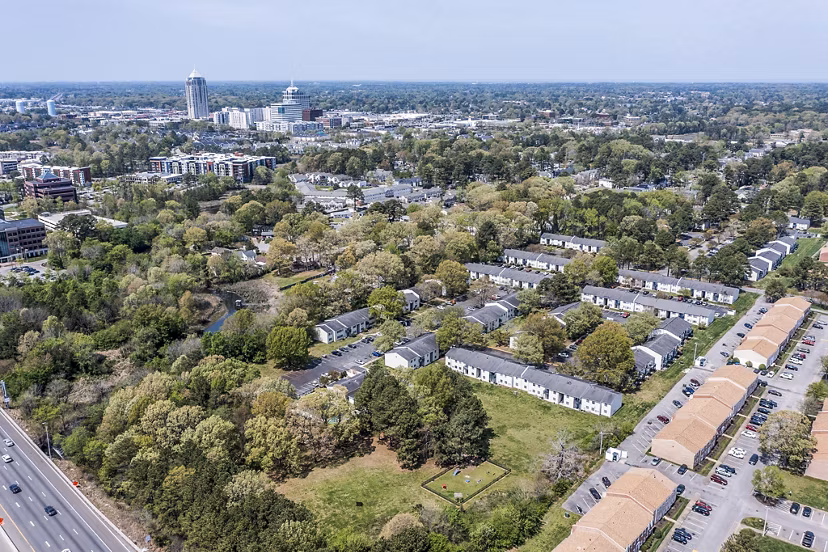 Woodshire Apartments: Elegant design in a luxury apartment complex with lush landscaping