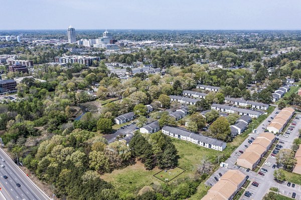 Woodshire Apartments: Elegant design in a luxury apartment complex with lush landscaping
