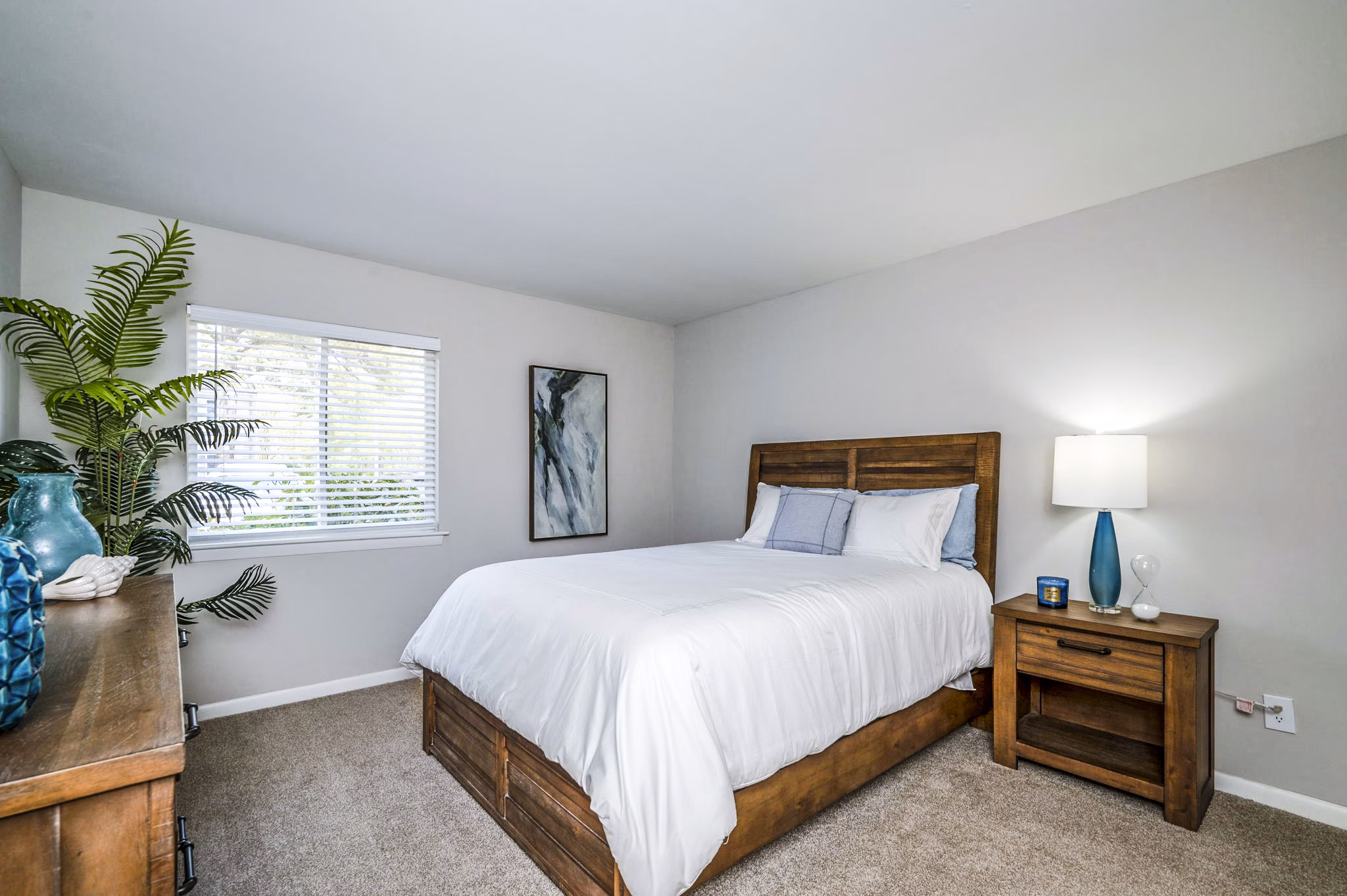 Cozy bedroom with contemporary decor in Woodshire Apartments