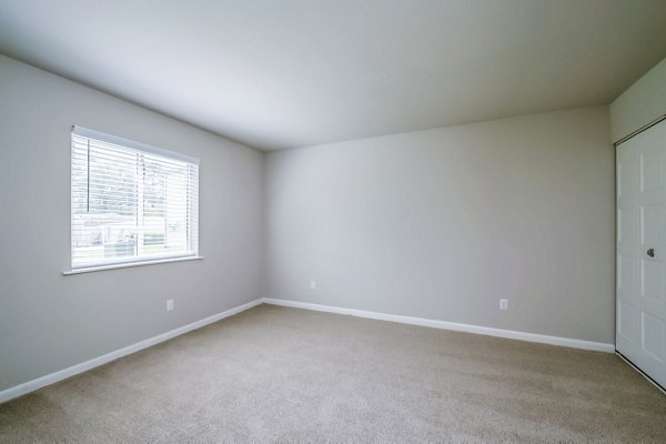 Cozy bedroom with modern decor at Woodshire Apartments