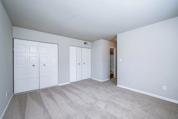 Cozy bedroom with modern design elements at Woodshire Apartments