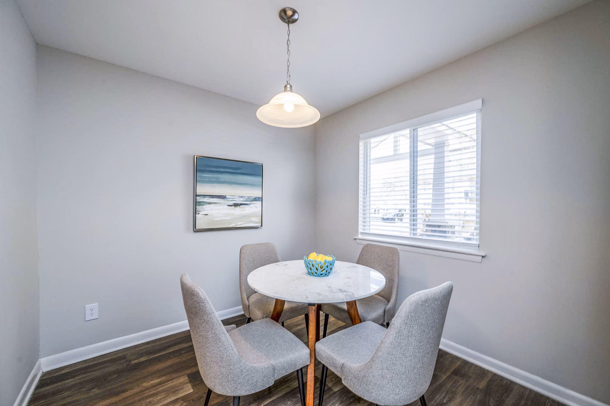 Dining room featuring elegant decor and modern lighting at Woodshire Apartments, a Greystar luxury complex