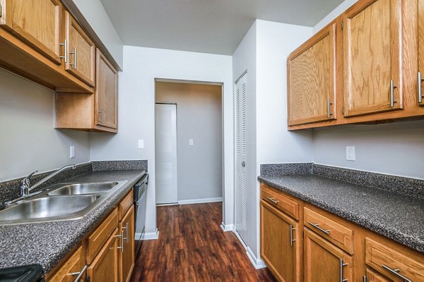 Woodshire Apartments: Modern kitchen with stainless steel appliances and granite countertops
