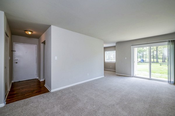 Cozy living room with contemporary decor at Woodshire Apartments