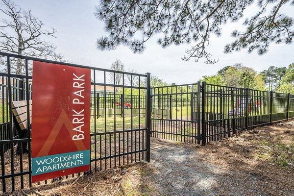 Dog park with agility equipment at Woodshire Apartments, perfect for pet-friendly living in Greystar community