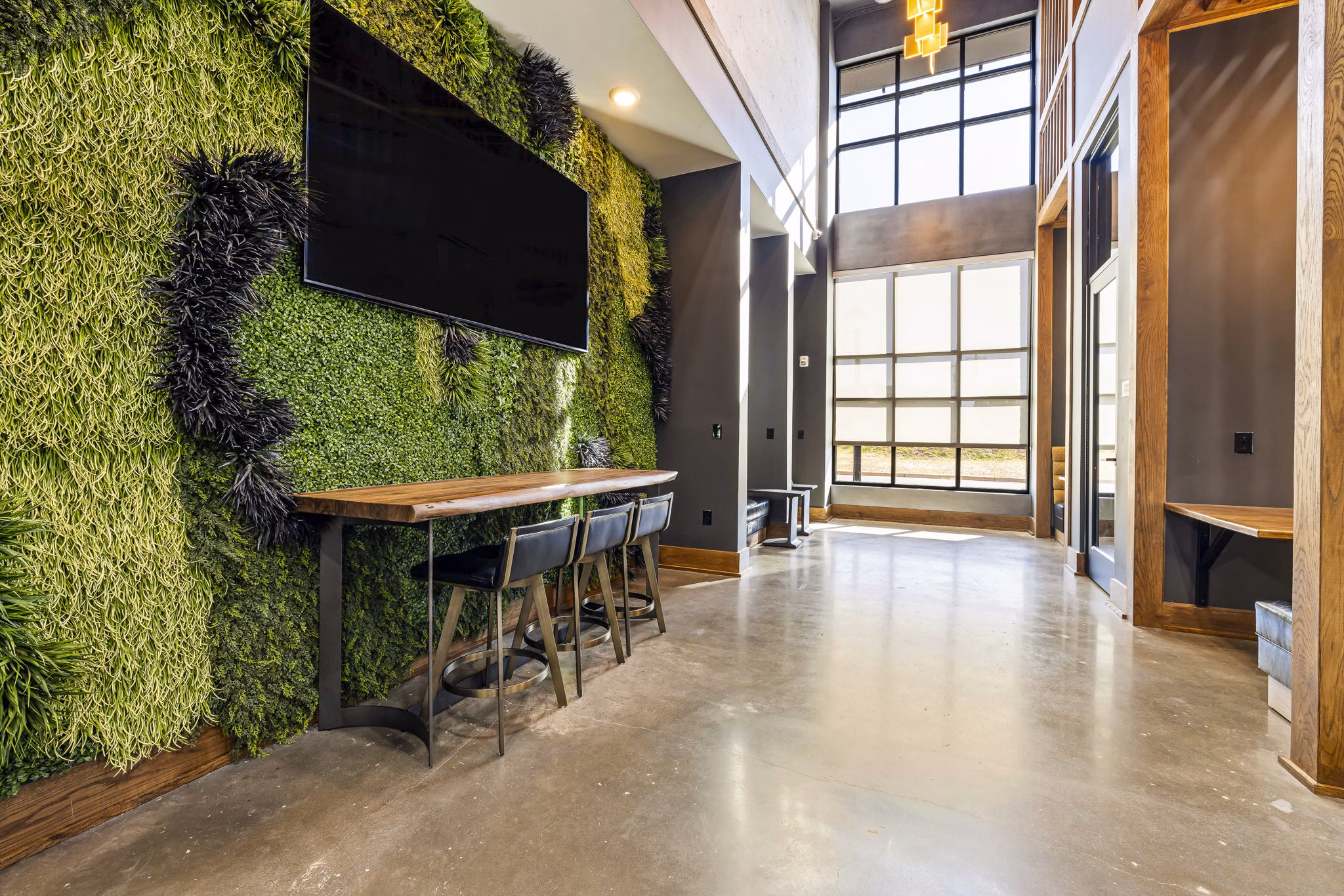 Stylish clubhouse with modern seating and decor at The Artreaux Apartments, offering luxury living experiences in a vibrant community setting