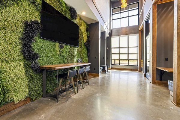 Stylish clubhouse with modern seating and decor at The Artreaux Apartments, offering luxury living experiences in a vibrant community setting