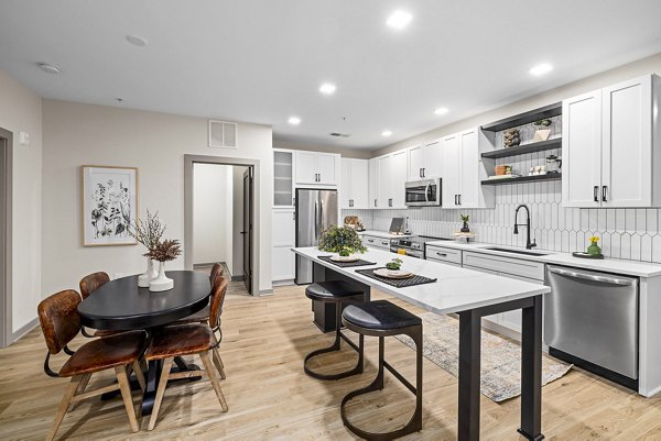 Dining room featuring elegant decor and modern lighting at The Artreaux Apartments in a Greystar luxury community