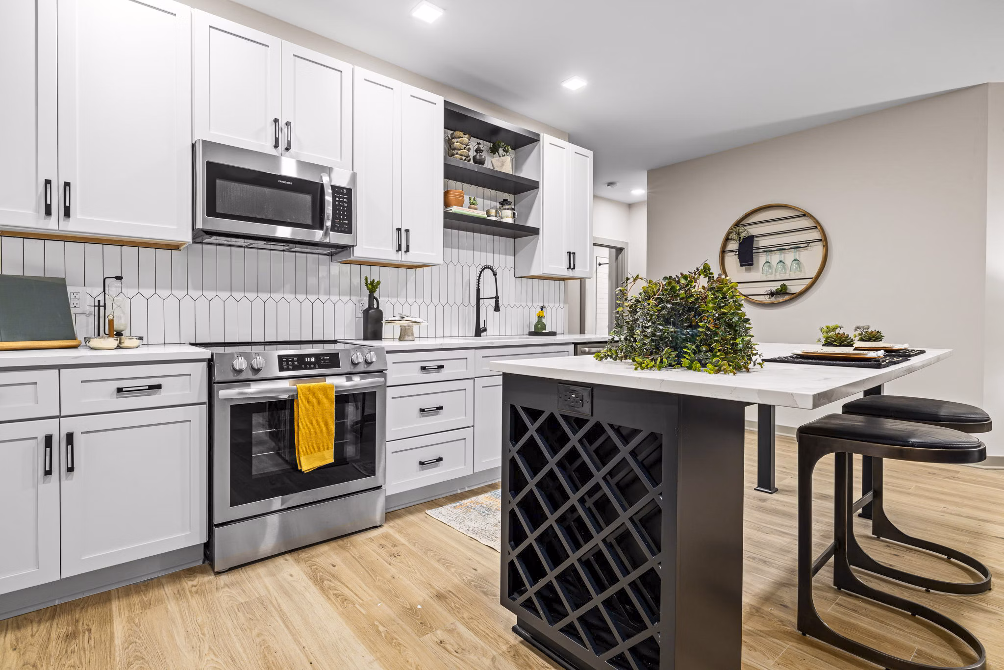 Modern kitchen with stainless steel appliances in The Artreaux Apartments