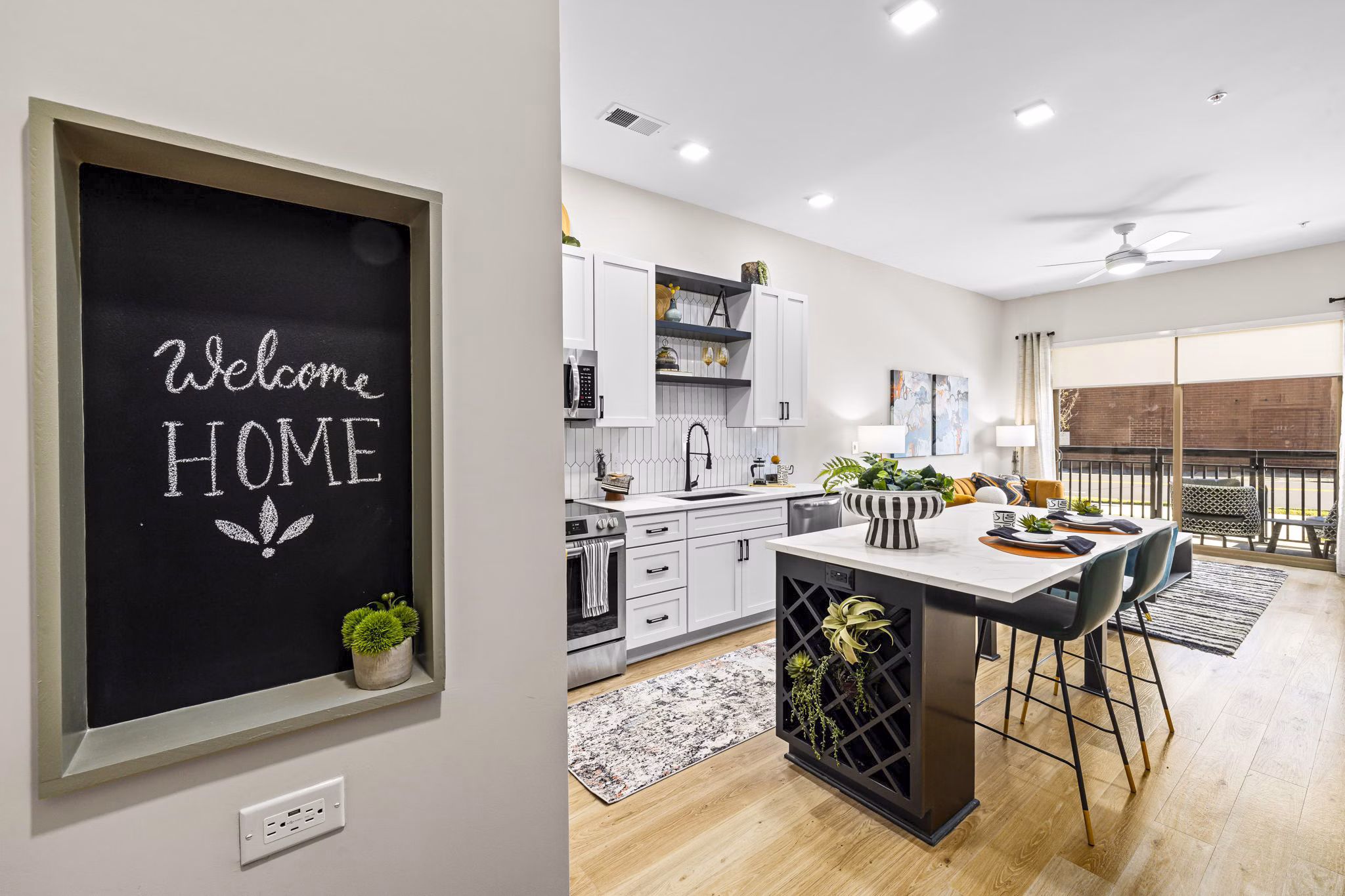 Modern kitchen with stainless steel appliances at The Artreaux Apartments, a luxury living space