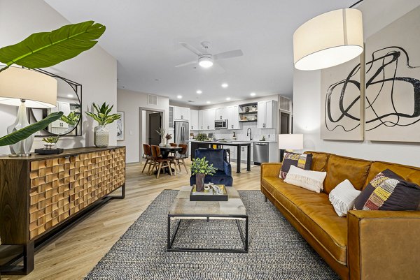 Spacious living room with modern decor at The Artreaux Apartments