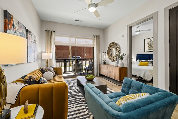 Bright living room with stylish decor and natural light at The Artreaux Apartments, a luxury Greystar community