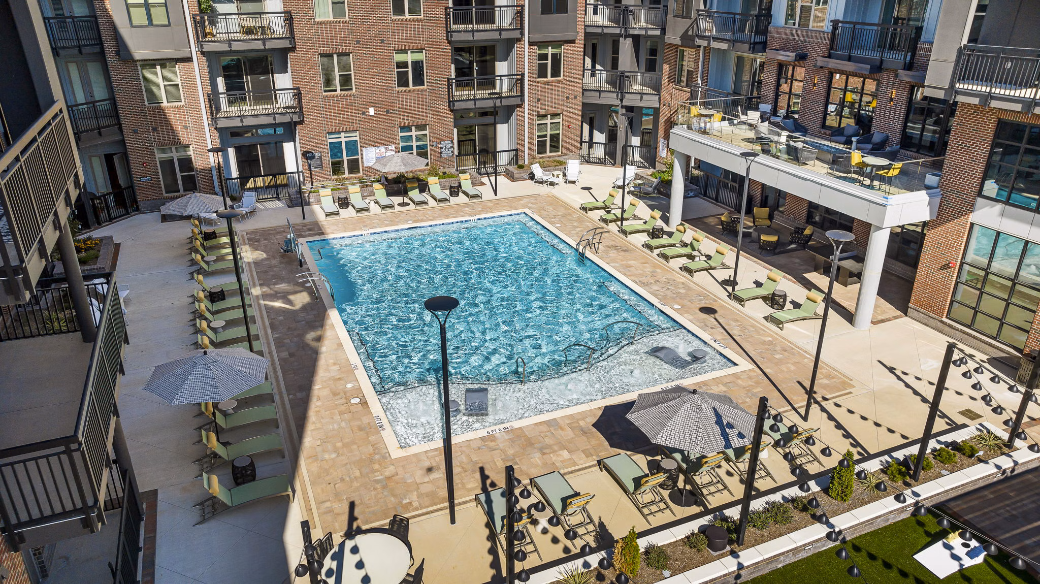 Luxurious poolside lounging at The Artreaux Apartments, a Greystar luxury property