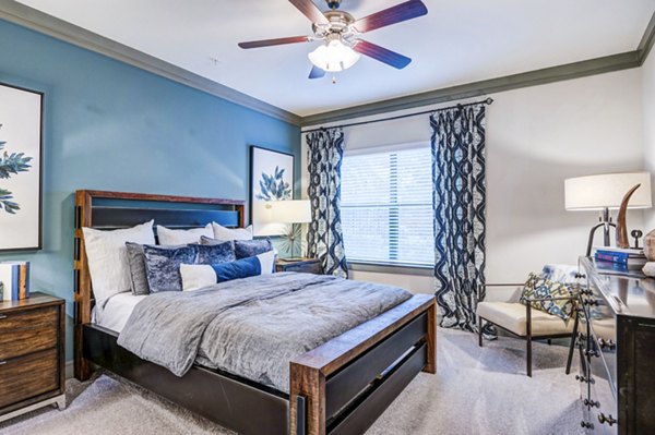 Harlow Spring Cypress Apartments: Spacious bedroom with large windows and modern decor