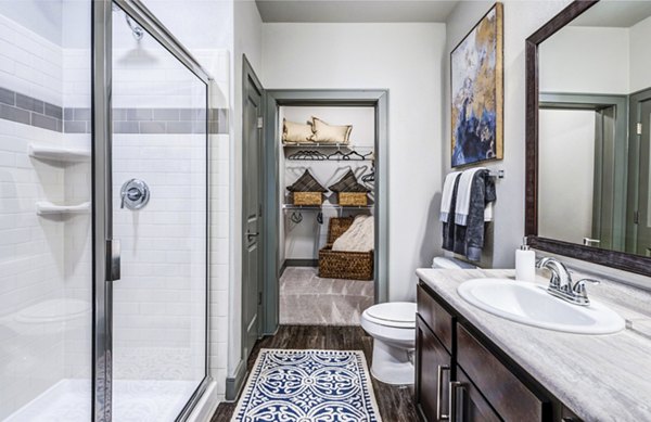 Modern bathroom with elegant fixtures at Harlow Spring Cypress Apartments