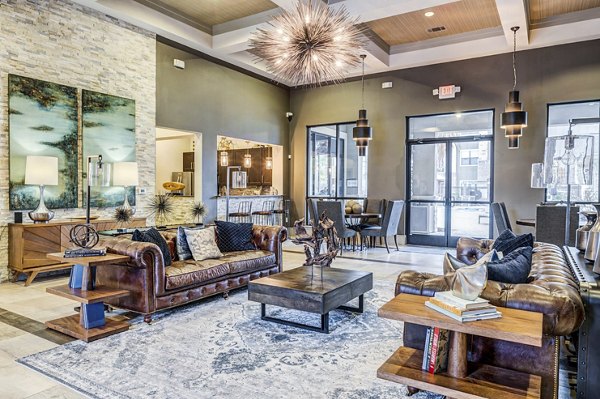 Harlow Spring Cypress Apartments: Elegant clubhouse lobby with modern seating and stylish decor