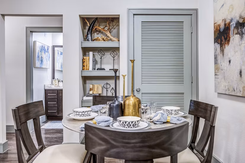 Dining area featuring modern furnishings and elegant lighting at Harlow Spring Cypress Apartments