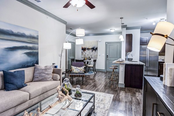 Spacious living room with modern decor in Harlow Spring Cypress Apartments